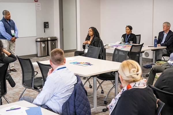 Female faculty speaking at a workshop