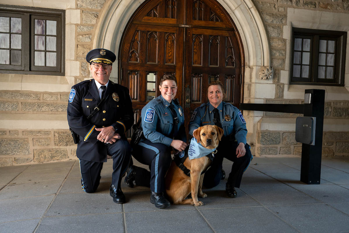 Taffy posing with officers