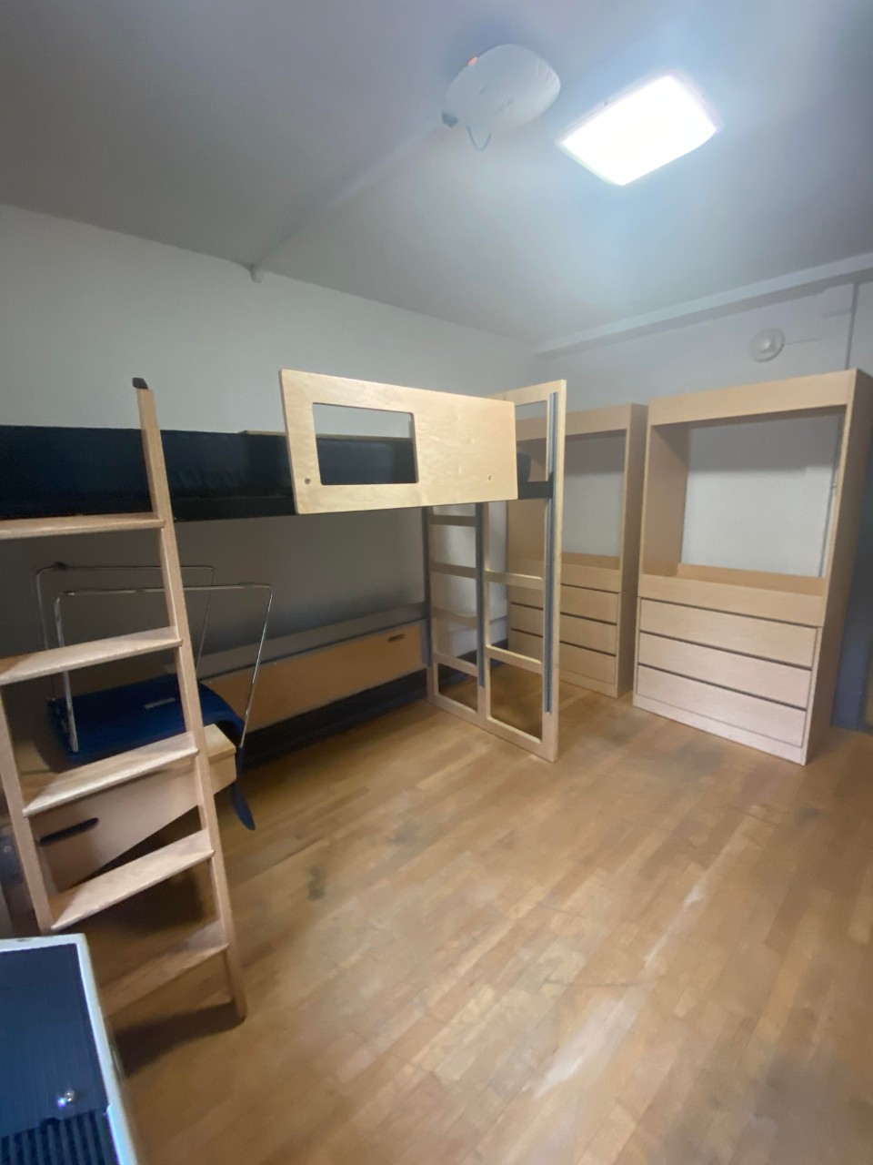 View of two beds and two desks in a Fedigan Hall double room.