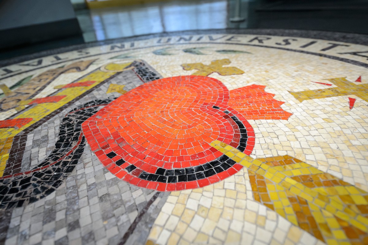 A close-up of a mosaic of the Villanova University seal at the St. Augustine Center