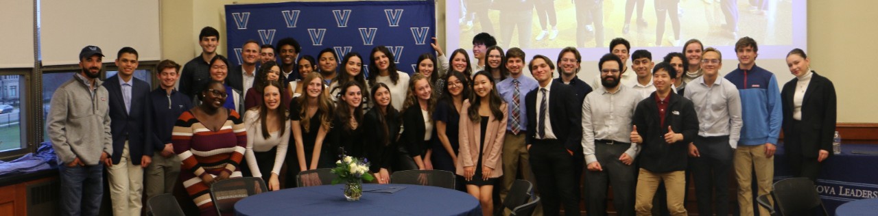 A group of students attends a Villanova Leadership Program awards dinner