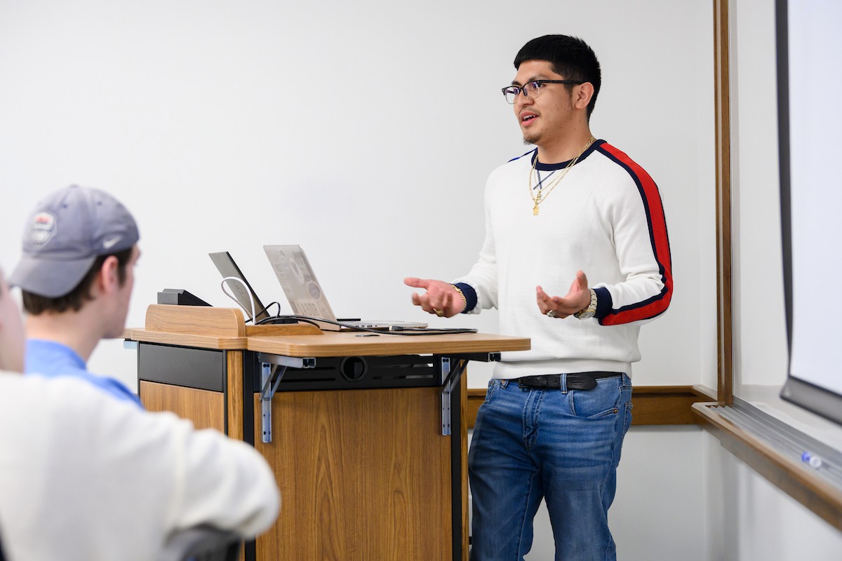 Student presenting in front of class