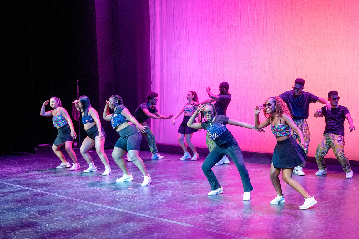 A student dance group performing in the Mullen Center.