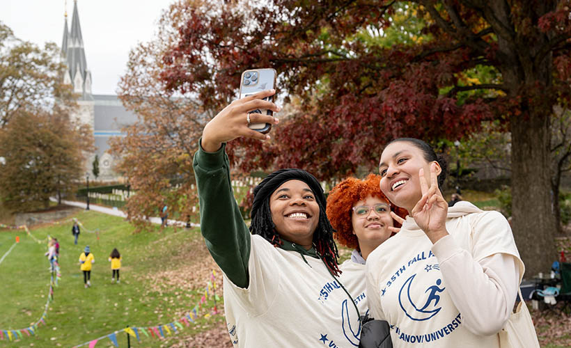 Three students taking a selfie.