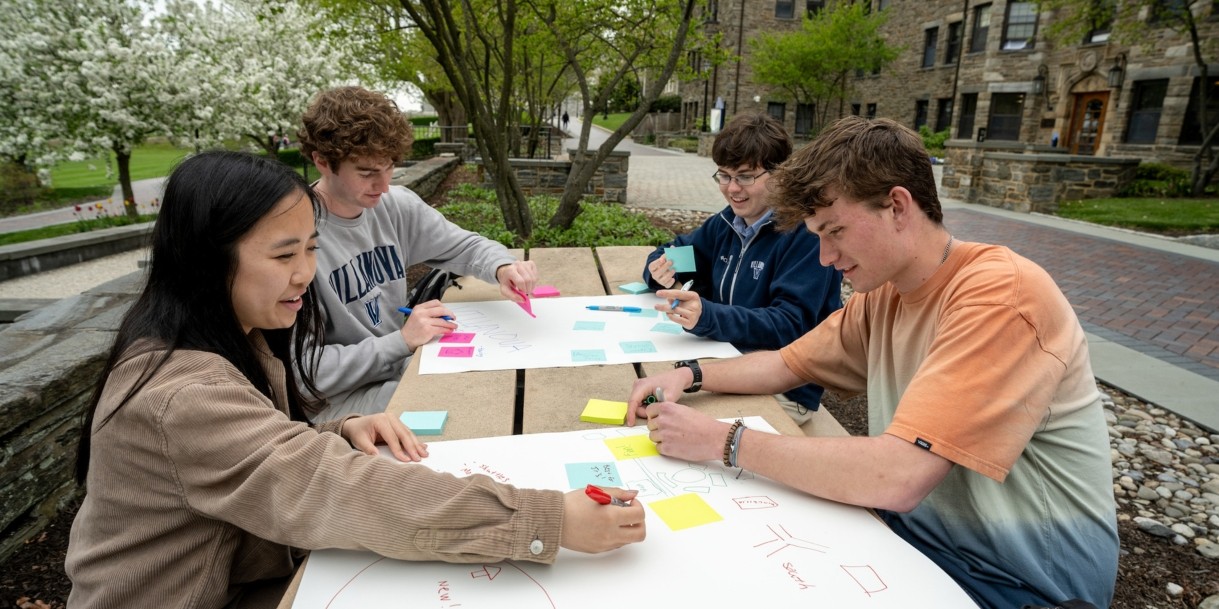 Students working on a project outside of Austin Hall.