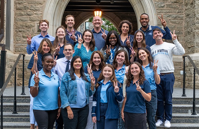 Admission staff giving "vs up"