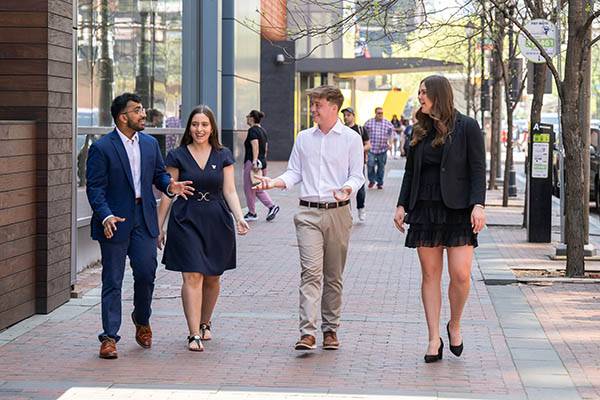 Students in business attire walking in Philadelphia.