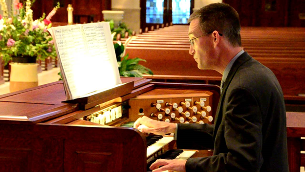 Dr. Christopher Daly playing the organ.