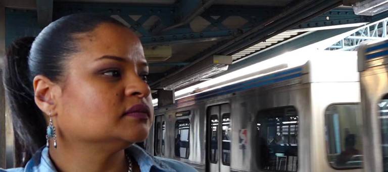 face of Roz Pichardo with subway train in background