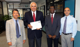 Dr. Moeness Amin, Director of the Center for Advanced Communications (center left), receives recognition from leaders of the ICT Institute at UOW, including: Dr. Salim Bouzerdoum, Associate Dean for Research (left); Dr. Philip Ogunbona, Dean of Informatics (center right); and Dr. Farzad Safaei, Director of the ICT Institute (right).