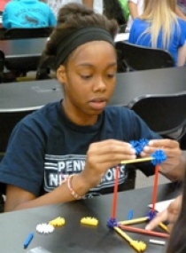 Participants applied lessons learned in class to hands-on activities, such as building truss bridges with Knex.