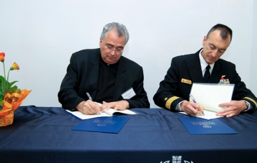 Rev. Peter M. Donohue; OSA, PhD, ’75 A&S, and RDML Randolph L. Mahr, Commander, Naval Air Warfare Center Aircraft Division and Assistant Commander for Research and Engineering