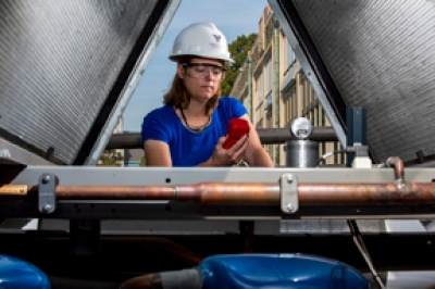 Professor Amy Fleischer, PhD, measures waste heat at the campus cooling towers.