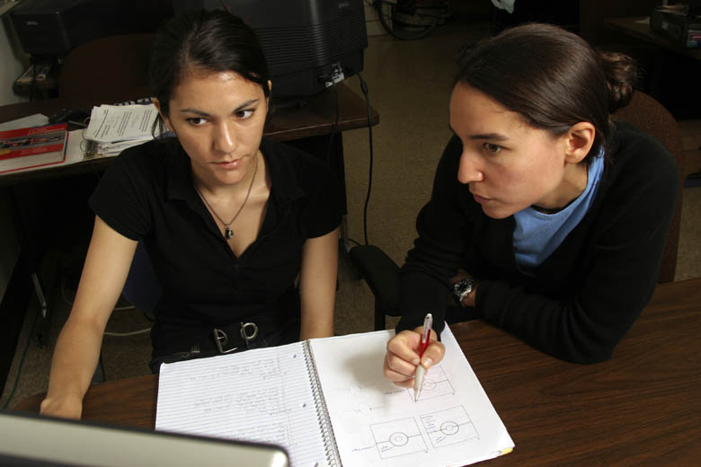 Dr. Ani Ural (right) explains a concept to one of her Mechanical Engineering students.   