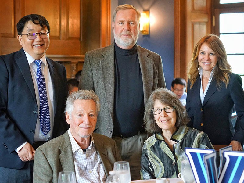 Dr. Sheldon Weinbaum (seated, left) and his wife, Sandy, are joined by Villanova professors Dr. Qianhong Wu (standing, left) and Dr. Jerry Jones and Dean Michele Marcolongo at the Inn at Villanova.