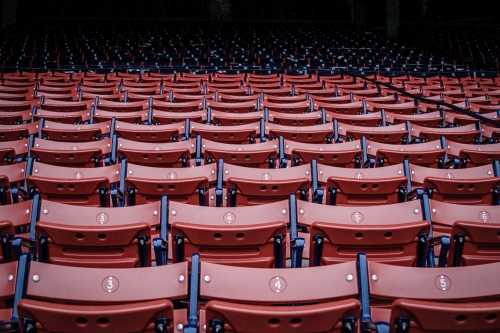 Empty red stadium chairs