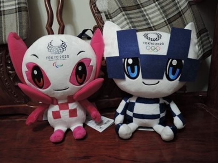 Pink and blue stuffed toys bearing the Olympic logos