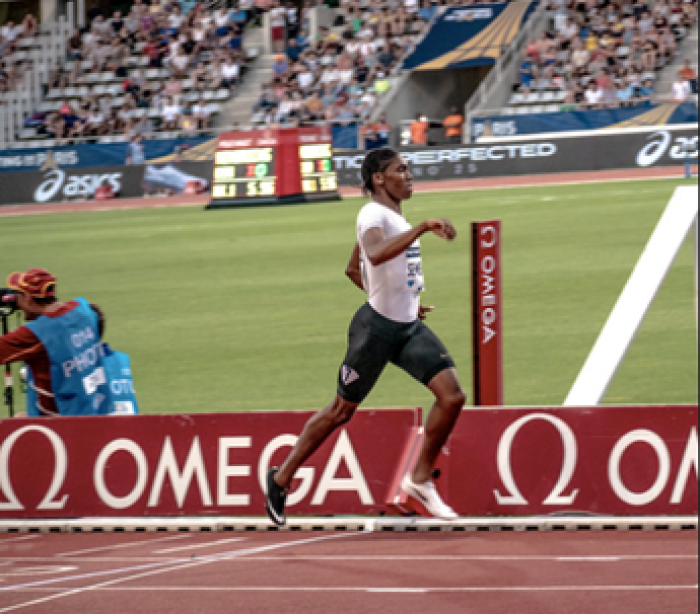 Track star Carter Semenya on red running track in stadium