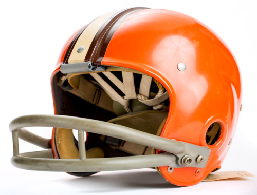 Single brown and orange Cleveland Browns football helmet sits on white background