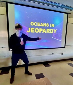 tory chase posing as character captain conservation in his marine ecology class that teaches science communication