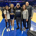 grandfather with family members on the court of Villanova basketball game