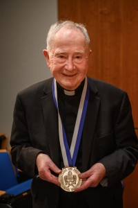 John W. O'Malley, SJ, PhD, wearing medal