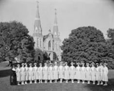 Students in front of St. Thomas of Villanova Church. October 1957. 
