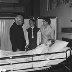 President John M. Driscoll, OSA and Dean Dorothy Marlow with nursing student in new lab in St. Mary Hall. 1975.