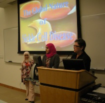 Dr. Elizabeth Petit de Mange introduces Mudhar Al Adawi and Zayana Al Saudi's presentation.