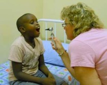 Dr. Elizabeth Blunt examines a boy at St. Theresa's Home for Children
