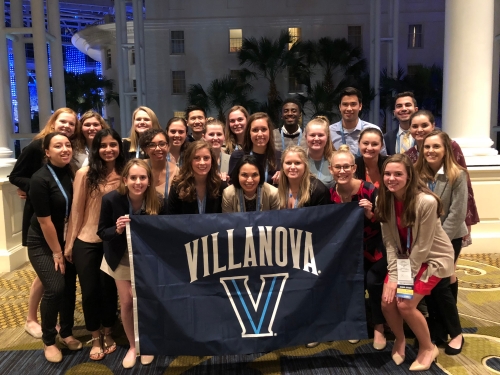 SNAP group holds Villanova flag at NSNA convention hotel