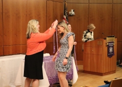Dr. Susan Meyers inducts student with Sigma honor cord