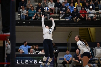 Ellery Gray jumps for volleyball