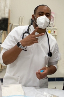 Male nurse wearing scrubs in lab