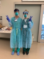 Two female nurses dressed in PPE.