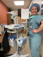 Female nurse standing near equipment