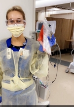 Female nurse dressed in PPE.