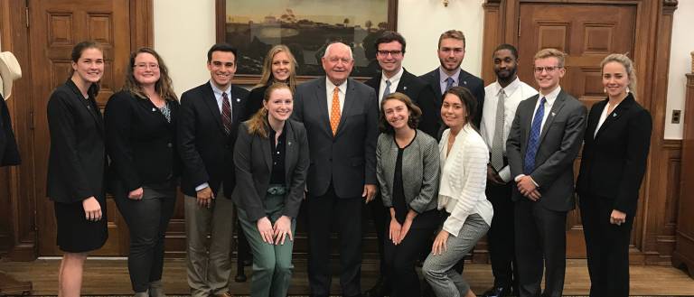 Students pause for a picture while visiting lawmakers on Capitol Hill