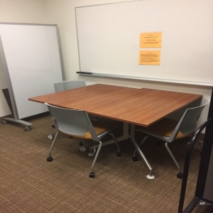 Inside room 203, includes table, 3 chairs, and white board