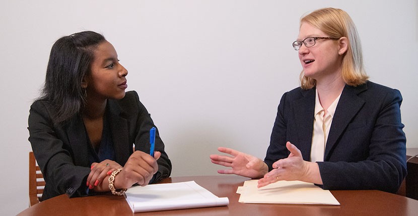 Faculty and students in discussion 