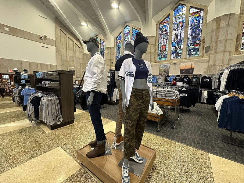 Clothes displayed in manequins in bookstore