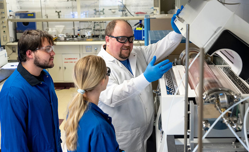 Professor and students in lab