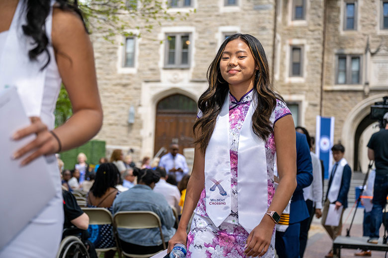 Female student walking at ceremony