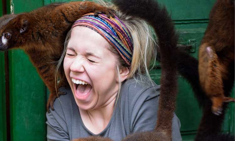 Student with a monkey sitting on their shoulder