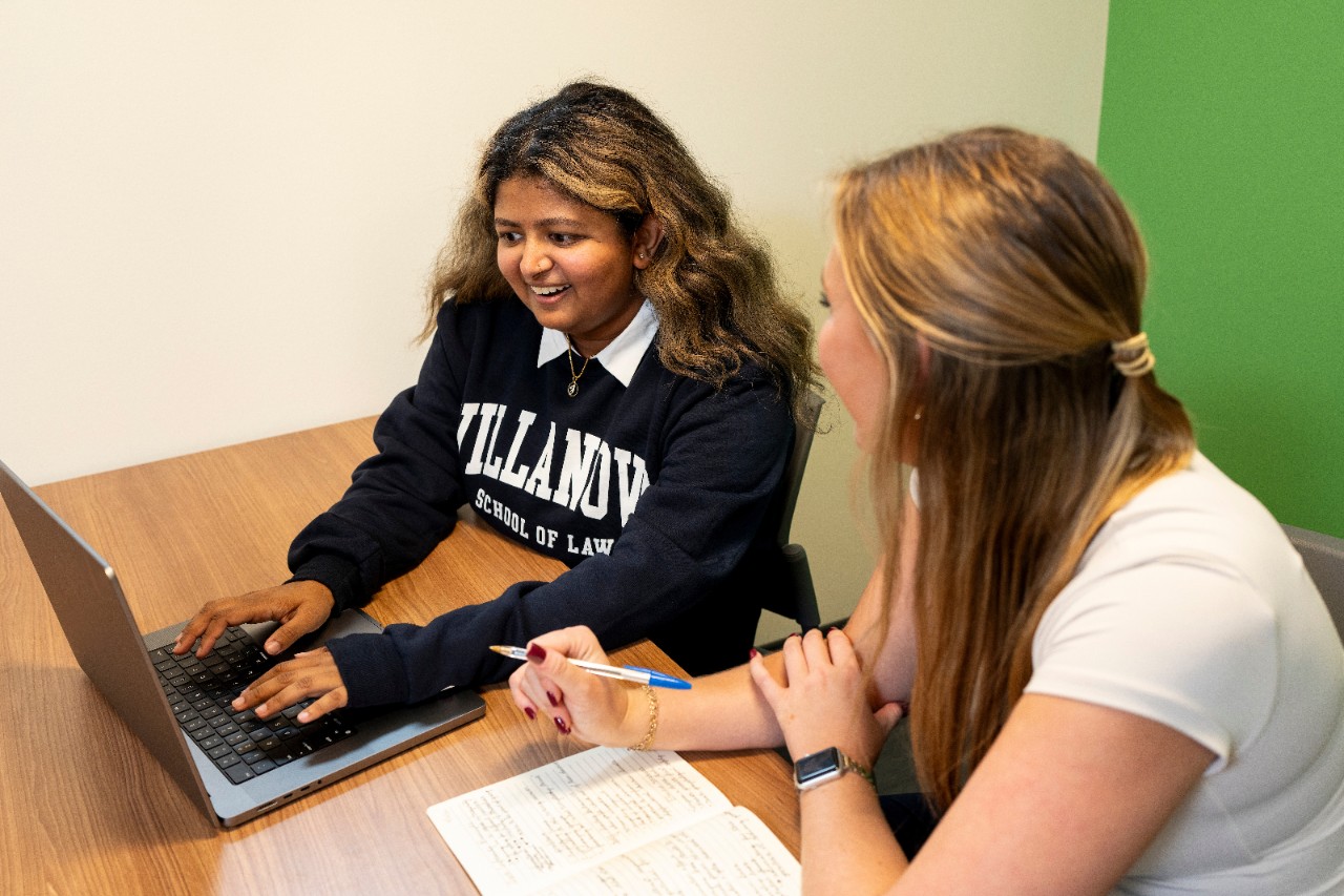 Female student speaking with classmate