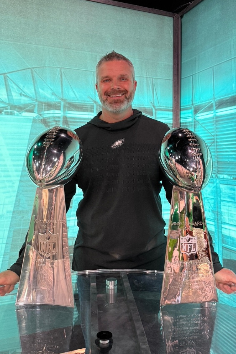 Eagles Football Team VP of Marketing Brian Papson with 2 Vince Lombardi trophies