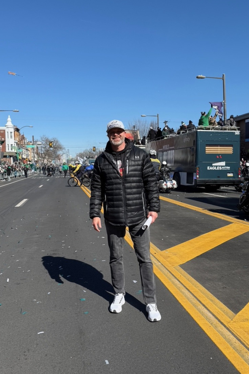 Eagles Football Team VP of Marketing Brian Papson in the middle of the SuperBowl Parade Route on Broad Street Philadelphia