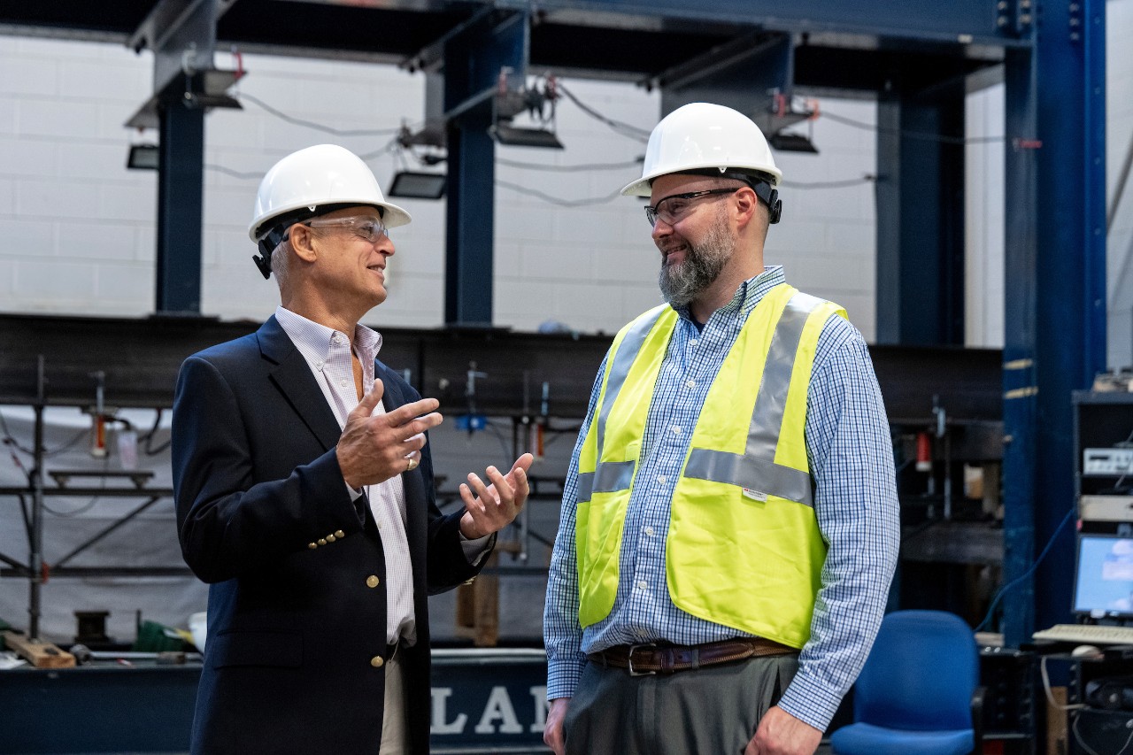 two men in hardhats conversing