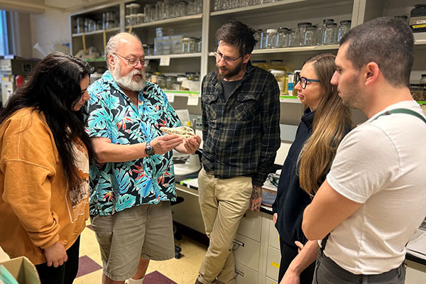 Aaron Bauer and students in a lab