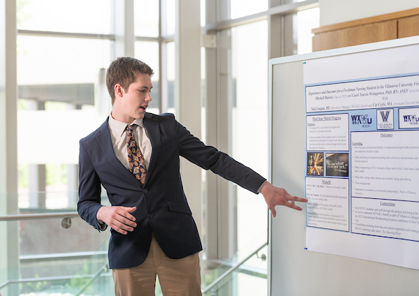 Student presenting at a research symposium